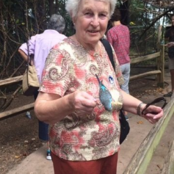 Image of LLP trip participant holding a beautiful bird on a trip to the Duke Gardens